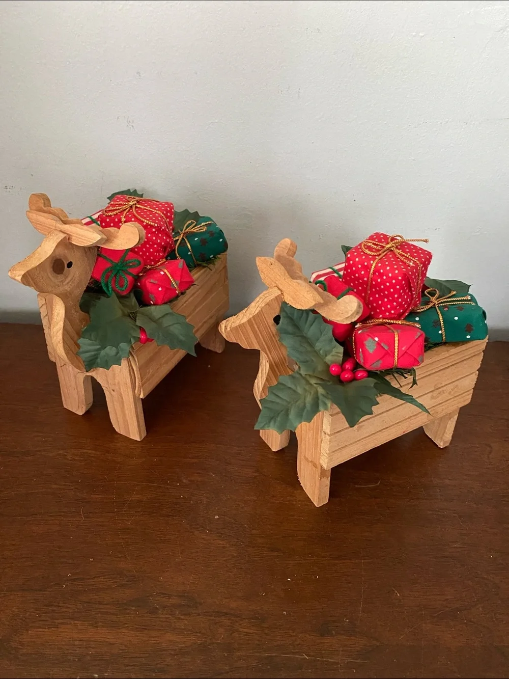 Pair of Vintage Wooden Reindeer box planters filled with Christmas gifts & holly